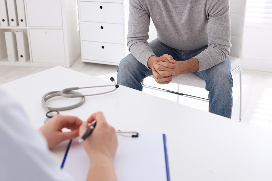 Man having appointment with STD specialist in clinic