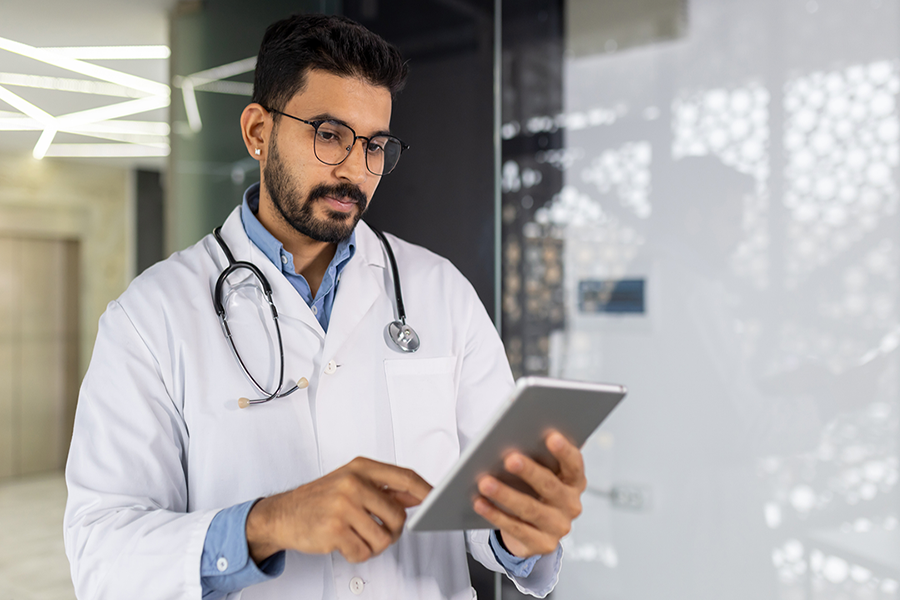 Healthcare provider viewing integrated patient data on a tablet through the SHARE health information exchange system
